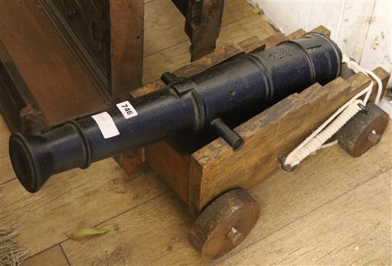 A model cannon on oak carriage W.35cm